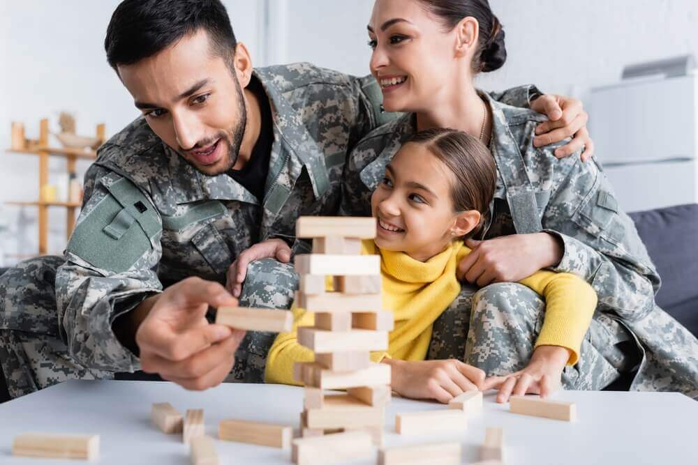 Military Family Playing Military Family Playing With Blocks