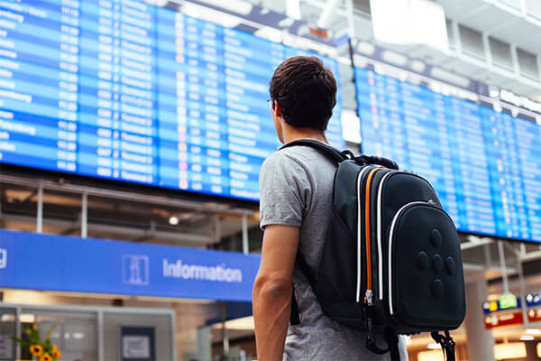 Veteran at the airport terminal looking for a discounted flight