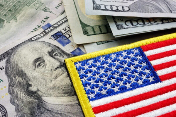 U.S. dollars next to an American flag patch