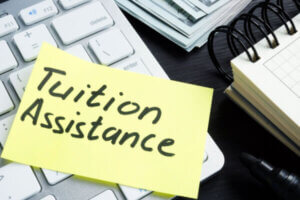 Tuition Assistance written on a sticky note