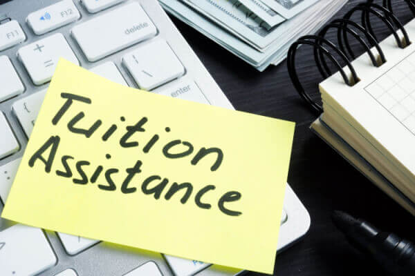 Tuition Assistance written on a sticky note