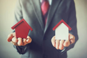 Lender holding two models of a house