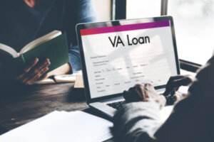 Military member researching VA loans on computer