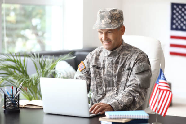 Military service member applying for a side job on the computer