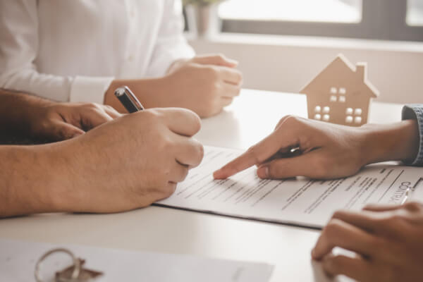 Mortgage lender explaining the paperwork