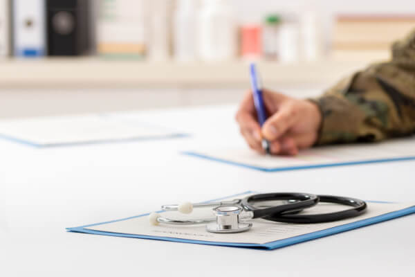 Veteran filling out insurance paperwork