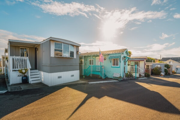 A row of mobile park homes with an american flag.